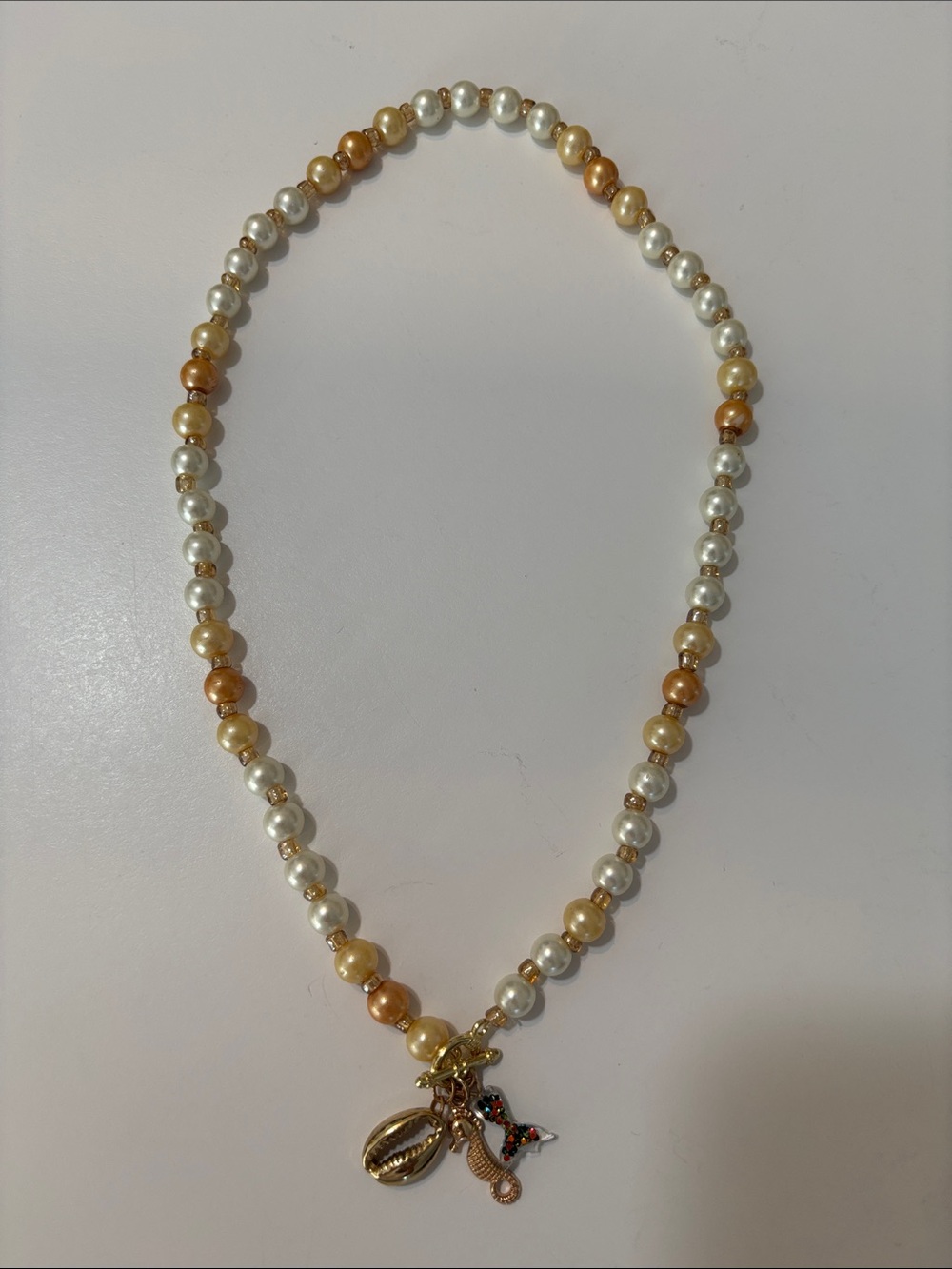 Gold and Pearl Bead Necklace with Charms - Women's Jewelry.  Charms are mermaid